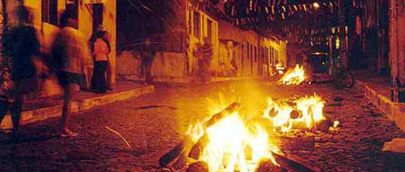 Bonfire lit in Lençóis during São João, illuminating the night in Chapada Diamantina.